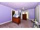Spacious bedroom with a ceiling fan, wood furniture, and ample space for storage at 2850 Tansel Rd, Indianapolis, IN 46234