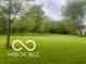 Expansive green yard with mature trees, offering a serene and spacious outdoor environment at 2850 Tansel Rd, Indianapolis, IN 46234