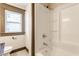 Bathroom with shower-tub combination and a window at 3543 N Kenwood Ave, Indianapolis, IN 46208