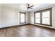 Bright bedroom with ceiling fan, natural light, and wood-look floors at 3543 N Kenwood Ave, Indianapolis, IN 46208