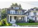 Charming home featuring new siding, complemented by a welcoming front porch and landscaped yard at 3543 N Kenwood Ave, Indianapolis, IN 46208