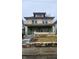 Exterior of a two-story home with a covered front porch and yard, showcasing its potential at 3543 N Kenwood Ave, Indianapolis, IN 46208