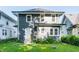 Well-kept two-story house featuring a modern exterior and a lovely green lawn at 3543 N Kenwood Ave, Indianapolis, IN 46208