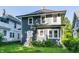 Inviting two-story home with a classic design and a lush, green lawn, perfect for Gathering living at 3543 N Kenwood Ave, Indianapolis, IN 46208