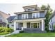 Charming home featuring new siding, complemented by a welcoming front porch and landscaped yard at 3543 N Kenwood Ave, Indianapolis, IN 46208