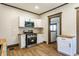 The updated kitchen has stainless steel appliances, white cabinets, and wooden countertops at 3543 N Kenwood Ave, Indianapolis, IN 46208