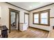Kitchen featuring neutral paint, hardwood floors, and an opening to a large staircase at 3543 N Kenwood Ave, Indianapolis, IN 46208