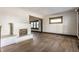 Inviting living room with a decorative fireplace, neutral paint, and beautiful hardwood floors at 3543 N Kenwood Ave, Indianapolis, IN 46208