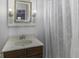 Bathroom features a marble sink and bathtub with decorative curtain at 3807 S Olney St, Indianapolis, IN 46237