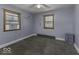This bedroom is freshly painted and carpeted with two windows for natural light at 3807 S Olney St, Indianapolis, IN 46237