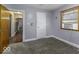 This bedroom features two windows and a carpeted floor, creating a cozy and comfortable space at 3807 S Olney St, Indianapolis, IN 46237