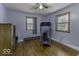 Comfortable bedroom featuring laminate floors, a ceiling fan, and natural light from the windows, ideal for relaxation at 3807 S Olney St, Indianapolis, IN 46237