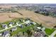 Community aerial showing the home's location near green spaces and roadways, with neighboring properties at 413 Cardinal Dr, Jamestown, IN 46147