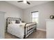 Warm bedroom with iron frame bed and soft textiles at 413 Cardinal Dr, Jamestown, IN 46147