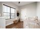 Cozy bedroom featuring crib, closet and window at 413 Cardinal Dr, Jamestown, IN 46147