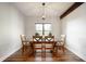 Bright dining room with wood floors, exposed beam and modern light fixture at 413 Cardinal Dr, Jamestown, IN 46147