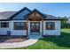 Inviting home entrance showcasing a wooden beam structure, double doors, and a walkway at 413 Cardinal Dr, Jamestown, IN 46147