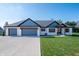 Charming home featuring a three-car garage, manicured lawn, and inviting exterior at 413 Cardinal Dr, Jamestown, IN 46147
