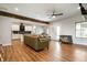 Spacious living area with hardwood floors, modern lighting, and an open flow to the kitchen at 413 Cardinal Dr, Jamestown, IN 46147