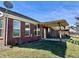 Brick home's backyard featuring a pergola-covered patio, perfect for outdoor entertaining at 4310 Yarrow Ct, Indianapolis, IN 46237