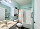 Full bathroom featuring a shower-tub combo, vanity sink, and medicine cabinet at 4310 Yarrow Ct, Indianapolis, IN 46237
