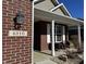 Inviting front porch with seating area and visible house number at 4310 Yarrow Ct, Indianapolis, IN 46237