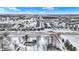 Winter aerial view of a sprawling suburban community with modern homes and snow-covered landscapes at 5461 Oak Knoll Dr, Whitestown, IN 46075