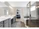 Bathroom with double sink vanity and glass shower, connecting to the bedroom at 5461 Oak Knoll Dr, Whitestown, IN 46075