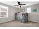 Charming bedroom with a lofted bed, ceiling fan, and neutral carpet at 5461 Oak Knoll Dr, Whitestown, IN 46075