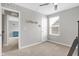 Bright bedroom with neutral carpet and walls and a connecting room at 5461 Oak Knoll Dr, Whitestown, IN 46075