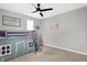 Cozy bedroom with a lofted bed, ceiling fan, and neutral walls at 5461 Oak Knoll Dr, Whitestown, IN 46075