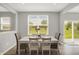 Spacious dining area with access to the backyard, showcasing a view of the outdoors at 5461 Oak Knoll Dr, Whitestown, IN 46075