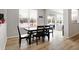 Bright dining room with hardwood floors and sliding glass doors at 5461 Oak Knoll Dr, Whitestown, IN 46075