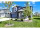 Charming two-story home showcasing a well-manicured lawn and tasteful landscaping at 5461 Oak Knoll Dr, Whitestown, IN 46075