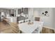 Well-appointed kitchen adjacent to the dining area, featuring gray cabinets and modern appliances at 5461 Oak Knoll Dr, Whitestown, IN 46075