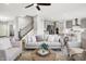 Bright and airy living room featuring stylish furnishings, a ceiling fan, and an open floor plan at 5461 Oak Knoll Dr, Whitestown, IN 46075