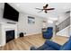 Cozy living room with a fireplace, TV, comfortable seating, and modern decor at 5461 Oak Knoll Dr, Whitestown, IN 46075