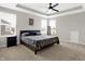 Bright main bedroom featuring a ceiling fan, large windows, and comfortable carpeting at 5461 Oak Knoll Dr, Whitestown, IN 46075
