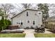 Backyard with hot tub, patio dining set, and string lights, creating a cozy outdoor retreat at 5626 Winthrop Ave, Indianapolis, IN 46220