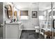 Modern bathroom with a double vanity, sleek fixtures, and a glass-enclosed shower at 5626 Winthrop Ave, Indianapolis, IN 46220