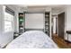 Bedroom showcasing a unique Murphy bed with built in storage shelves at 5626 Winthrop Ave, Indianapolis, IN 46220