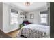 Inviting sitting area with comfy chair, hardwood floors, and natural light at 5626 Winthrop Ave, Indianapolis, IN 46220