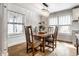Cozy dining room featuring wood table, chairs, and ample natural light from the windows at 5626 Winthrop Ave, Indianapolis, IN 46220