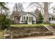 Charming home with a manicured lawn and inviting front porch, perfect for relaxing and enjoying the neighborhood at 5626 Winthrop Ave, Indianapolis, IN 46220