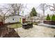 Backyard featuring detached garage, seating area and hot tub at 5626 Winthrop Ave, Indianapolis, IN 46220