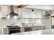 Well-lit kitchen with stainless steel appliances, subway tile backsplash, and sleek countertops at 5626 Winthrop Ave, Indianapolis, IN 46220