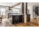 Modern kitchen featuring a stylish island with seating, bright countertops, and stainless appliances at 5626 Winthrop Ave, Indianapolis, IN 46220
