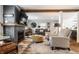Spacious living room with stylish furnishings, fireplace, and hardwood floors, perfect for entertaining and relaxing at 5626 Winthrop Ave, Indianapolis, IN 46220