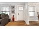 Bright living room featuring hardwood floors, neutral color scheme, and an inviting atmosphere at 5626 Winthrop Ave, Indianapolis, IN 46220