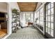 Bright and airy sunroom featuring beautiful windows, lovely furnishings, and a tranquil ambiance at 5626 Winthrop Ave, Indianapolis, IN 46220